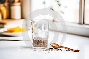 dark chia seeds soaked in a glass of water