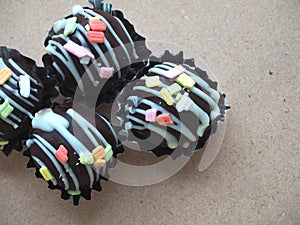 Dark chocolate balls with colorful topping