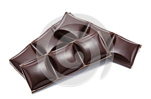 Dark chocolate bars stack with crumbs isolated