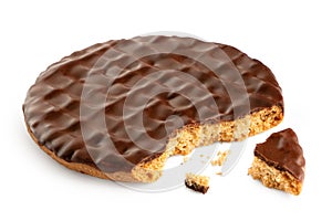 Dark chocolate coated digestive biscuit isolated on white. Partially eaten with crumbs