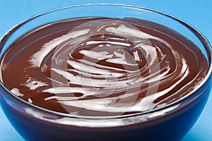 Dark chocolate cream on glass bowl