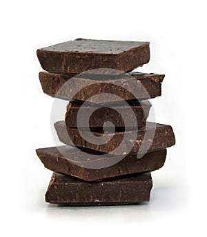 Dark chocolate cubes stack on white background