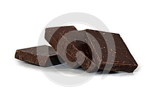 Dark chocolate cubes stack on white background