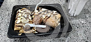 Dark chocolate ice cream roll with Oreo and cashew topping