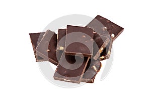 dark chocolate with nuts in a heap isolated on white background