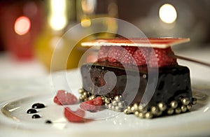 Dark chocolate tart with raspberry wafer