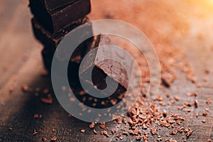 Dark chocolate on wooden table