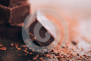 Dark chocolate on wooden table