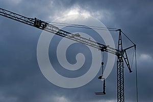 Dark clouds above a construction crane in the Netherlands