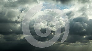 Dark clouds and cloud formations right in front of a thunderstorm. Gray rainy sky