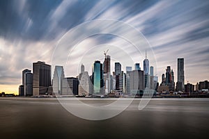 Dark clouds comming quickly over the New York Lower Manhattan during cloudy day