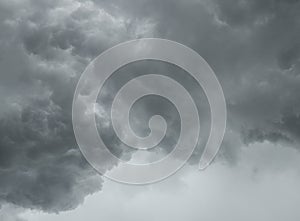 The dark clouds on dramatic sky background before the rainy weather