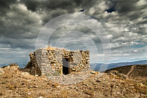 Dark clouds over a bergerie in Balagne region of Corsica