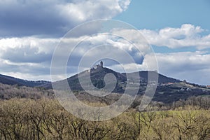 Dark clouds over the field and trees. Sky and field in the spring.Podhradie castle in Slovakia in the spring
