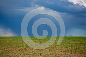 Dark clouds over field before a tunderstorm