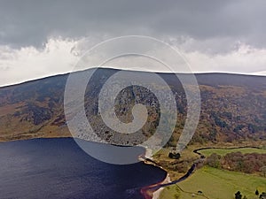 Dark clouds over Guiness lake in wicklow mountains