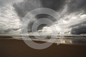 Dark clouds over the sandy beach