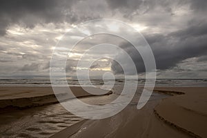 dark clouds over the sandy beach