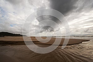 dark clouds over the sandy beach