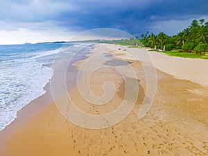 Dark clouds storm above landscape panorama Bentota Beach Sri Lanka