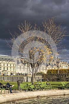 Dark clouds, thunderstorm, park in Paris center