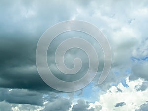 Dark cloudscape light blue sky background