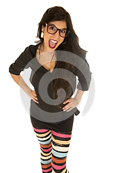 Dark complected female wearing colorful striped leggings with he