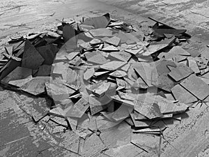 Dark concrete destruction surface with many chaotic broken piece