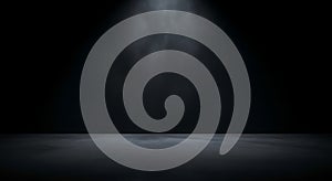 Dark concrete stage illuminated by a single spotlight