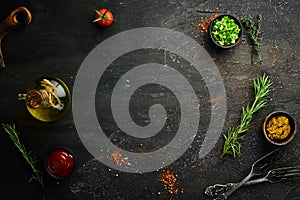 Dark cooking banner. Vegetables and spices on the kitchen table. Top view.