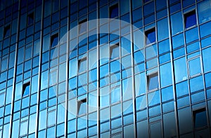 Dark corporate building glass windows architecture detail