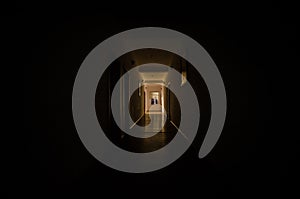 Dark corridor with cabinet doors and lights with silhouette of spooky horror man standing with different poses.