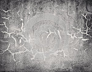 Dark cracked concrete wall texture with vignette