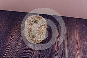 Dark craft thread on a wooden background
