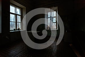 Dark and creepy room of old abandoned mental hospital at night