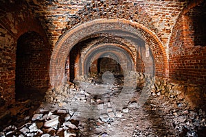 Dark and creepy vaulted red brick dungeon