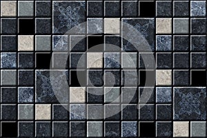 Dark decorative ceramic tiles with a natural stone texture. Marble mosaic, element for interior design.