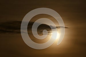 Dark dramatic cloud  at sun in evening sky