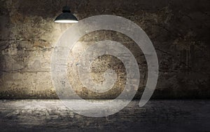 Dark empty room with old damaged concrete wall and ceiling lamp