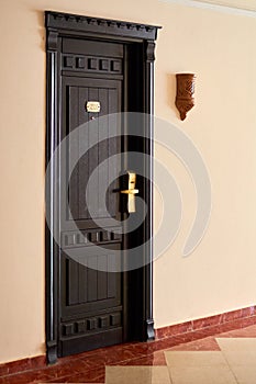 Dark entrance door with electronic keycard lock system, eastern
