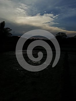 Evining with dark clouds and paddy field