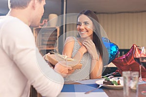 Dark-eyed beaming woman feeling really thankful