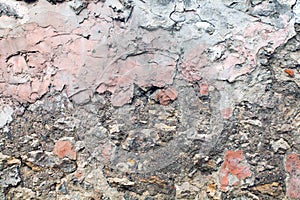 Dark faded concrete texture, molded old wall. close up