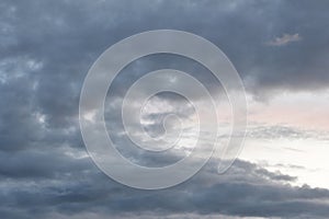 Dark gloomy gray cloudy sky before thunderstorm in summer. Storm heaven, gloomy backdrop