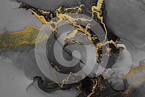 Dark gold abstract background of marble liquid ink art painting on paper .