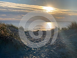 Dark gold sunset at West Wittering sand dunes