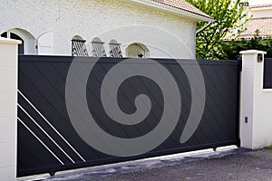 Dark gray aluminum gate portal grey of suburb house door access home garden