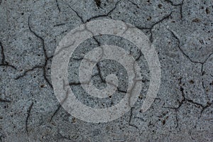 Dark gray background with cracks and hollows