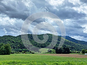 dark gray clouds over green Pohorje Mountains. Slovenia. Sky before storm