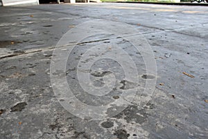 Dark gray concrete surface with stains photo